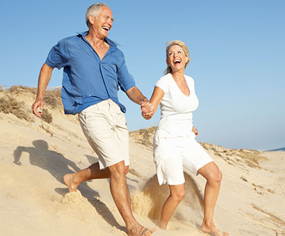 Elderly Couple on the beach enjoying Florida Blue in Sarasota