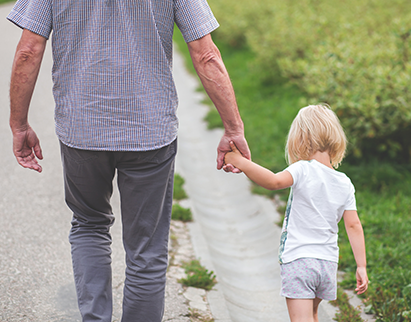 a man and child holding hands with Health Insurance in Lakeland, Tampa, Bradenton, Fort Myers, Sarasota, Cape Coral