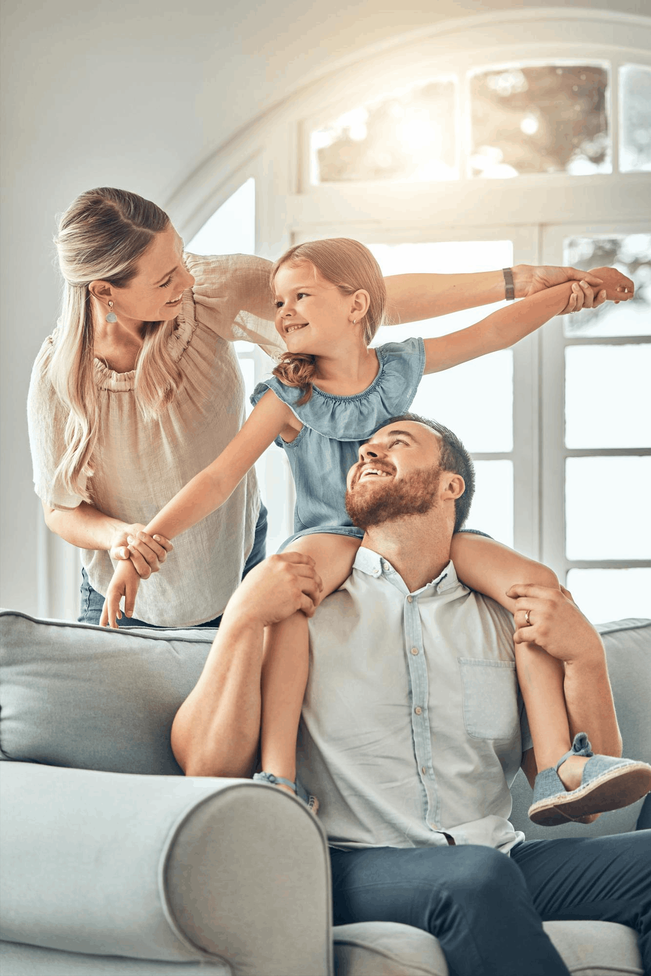 Father lifting his child at home with family health insurance in Sarasota