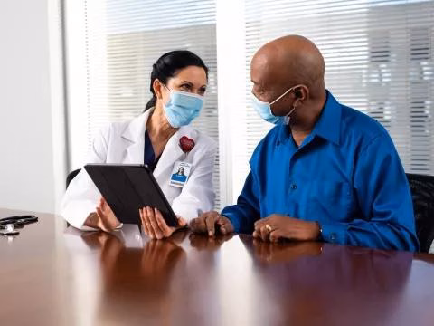 Doctor discussing hospital indemnity insurance with a patient in Tampa